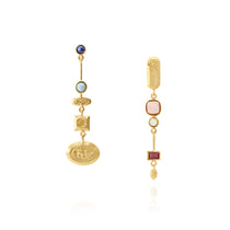Handmade gold flower earrings, asymmetrical with gemstones, flat lay, ethical earrings in chicago 