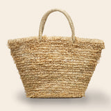 Natural Woven straw bag with a loop textured surface handmade in Rwanda through a fair trade partnership