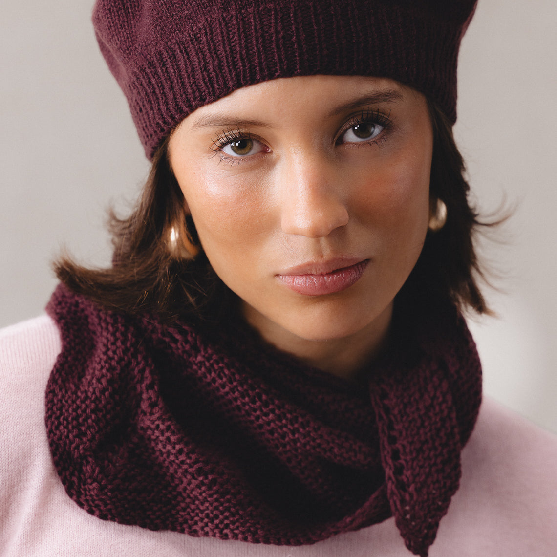 Merino wool handknit hat, burgundy, paired with merino wool pink sweater