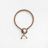 Pichulik Astarte Horn Necklace in beige handcrafted braided rope with brass clasp — Petite Protea: sustainable handmade necklace jewelry gifts