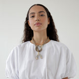 Astarte horn necklace on model: shop ethical handmade jewelry at petite protea: chicago jewelry boutique