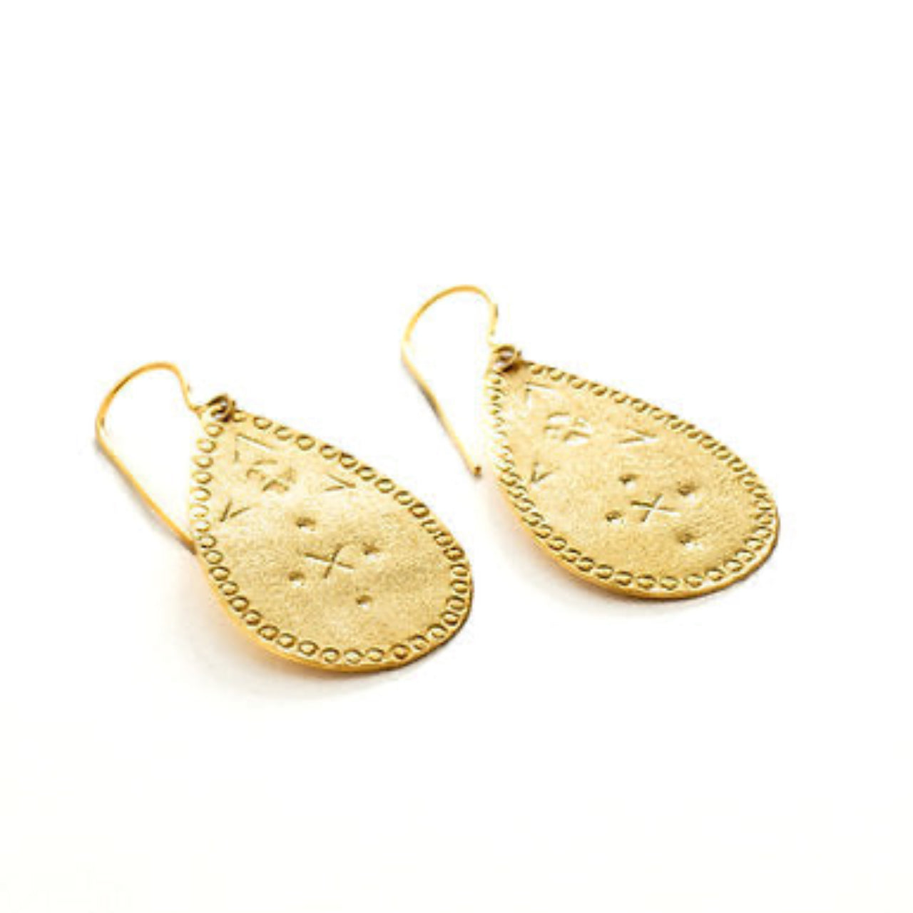 Gold earrings with intricate designs on a white background