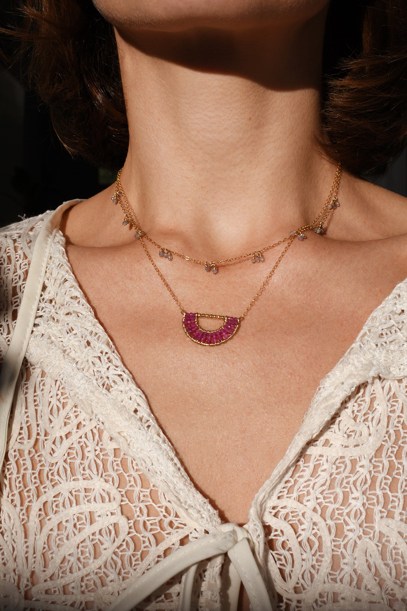 Artisan necklace with tanzanite and gold, handmade in Tanzania. Shop in Chicago and online at Petite Protea.