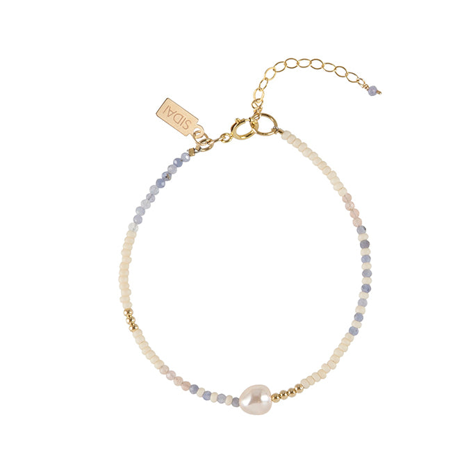Handmade tanzanite pearl bracelet, ethical artisan gift — Petite Protea Chicago